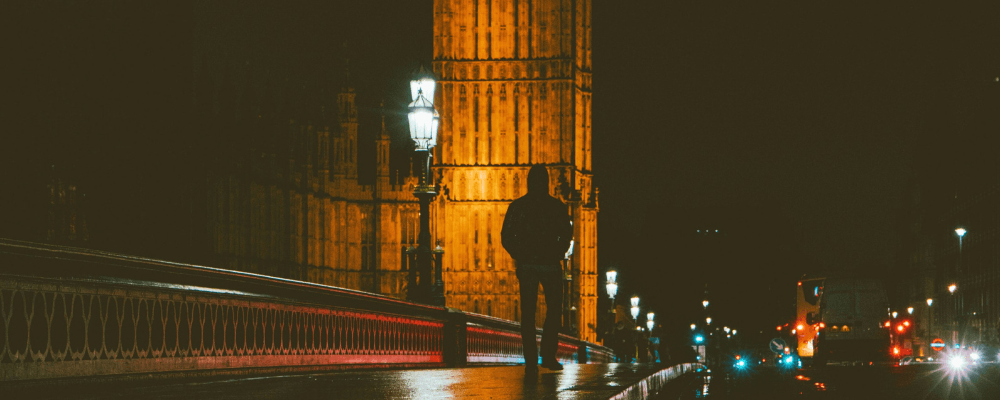 man walking at night london - a day in the life homelessness